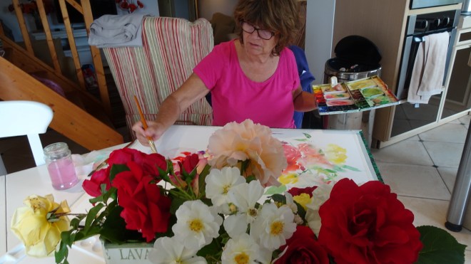 Tess painting roses