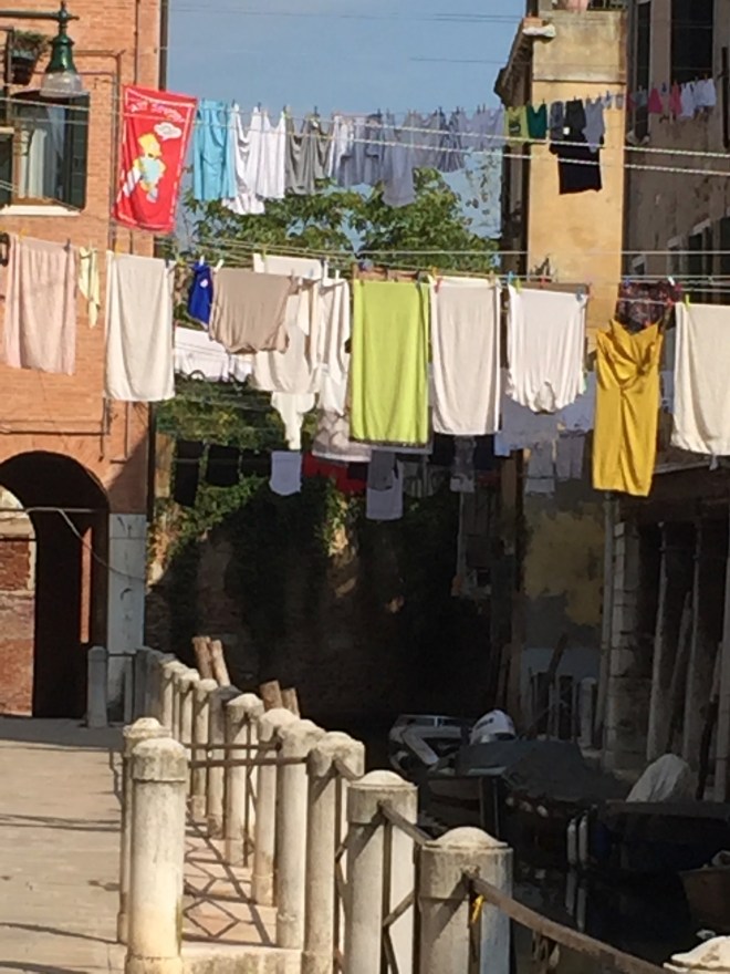 brightly coloured washing on the line Venice Canal