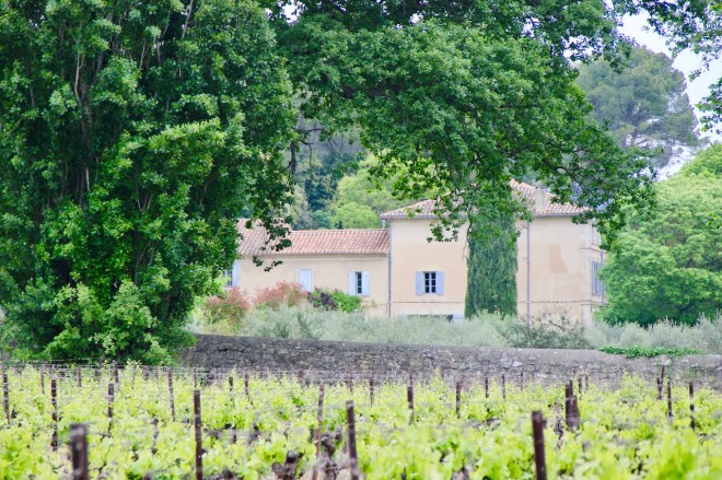 The view of our house in Provence through the vineyards